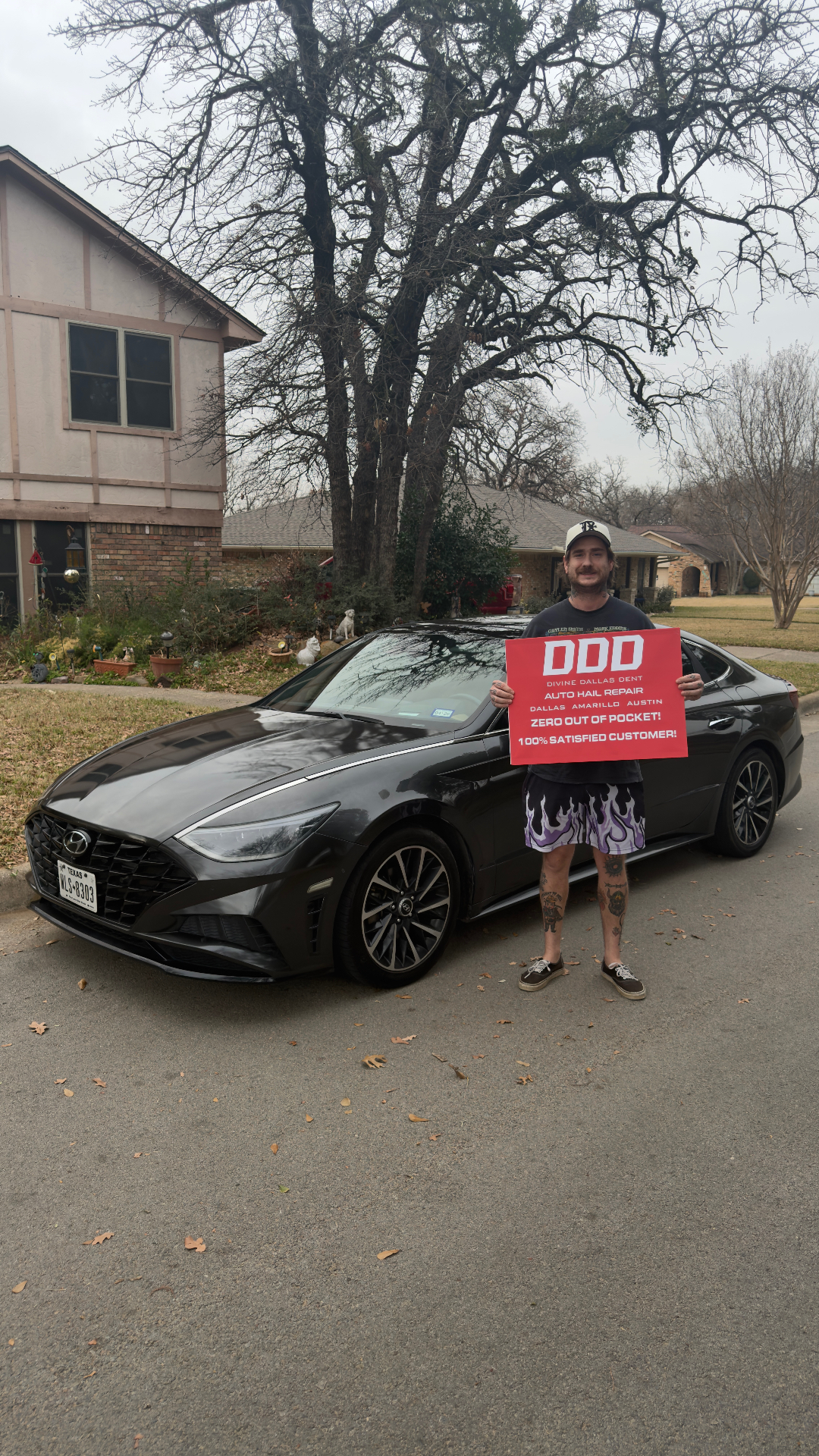 Happy Divine Dallas Dent customer with repaired vehicle
